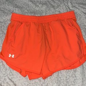 Small Under armor Neon Orange athletic shorts.